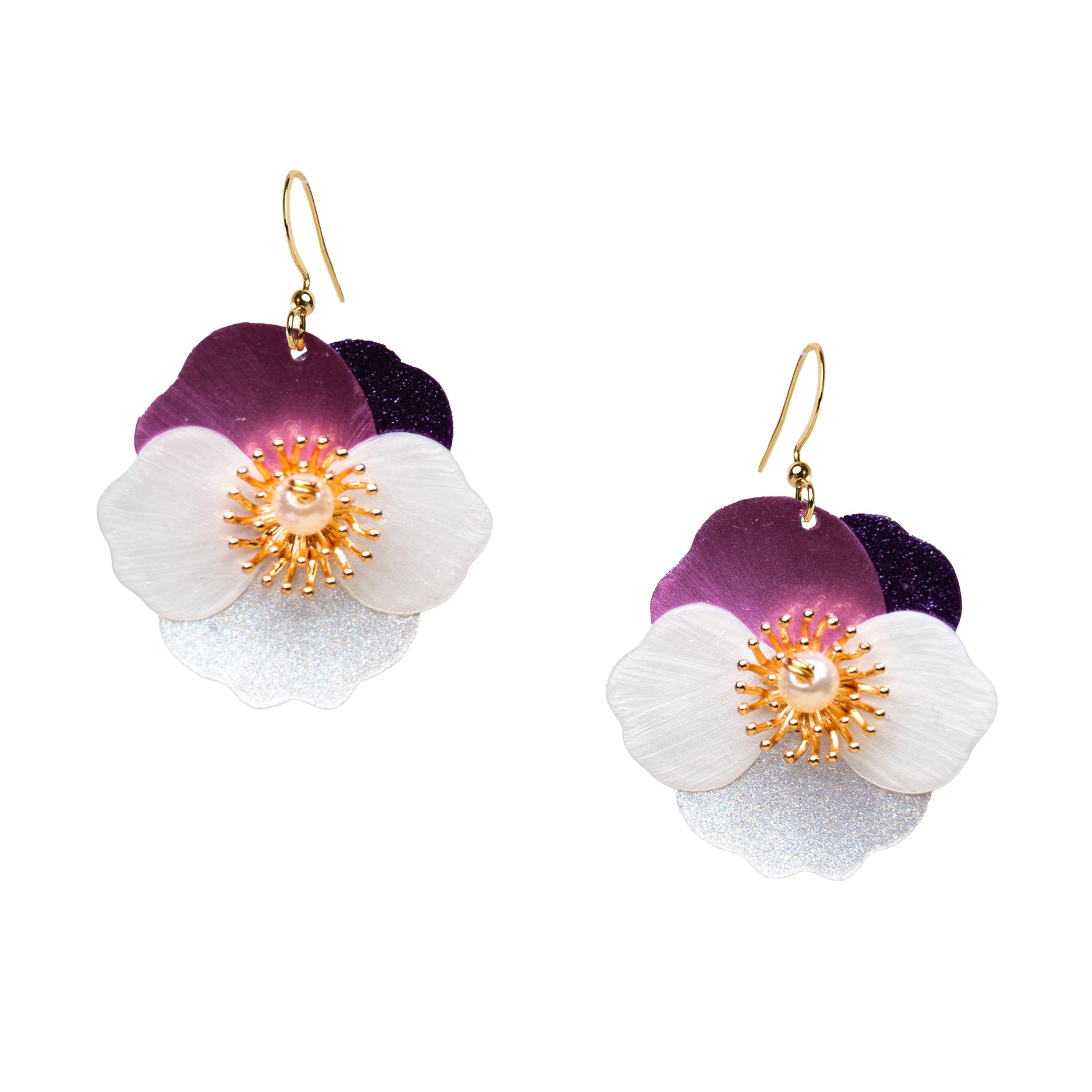 Floral earrings with purple, white, and gold details on a white background